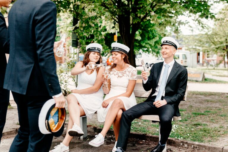Happy university students having champagne at graduation party