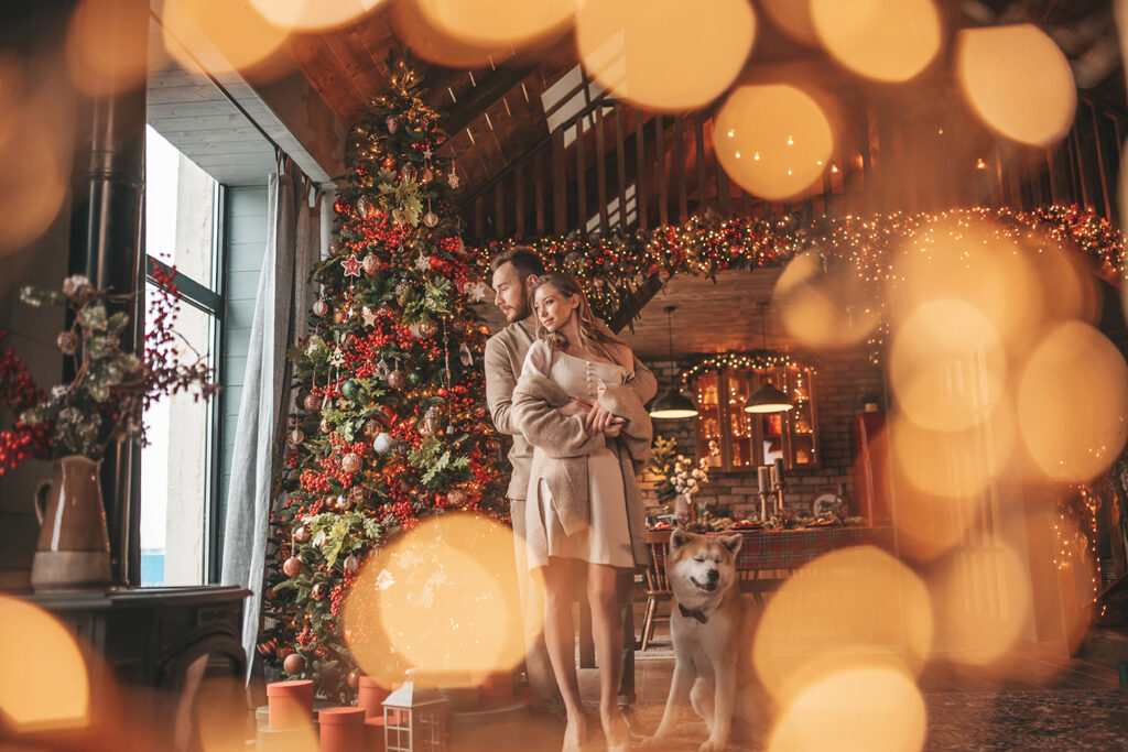 A couple snuggling in a cabin winter wedding reception