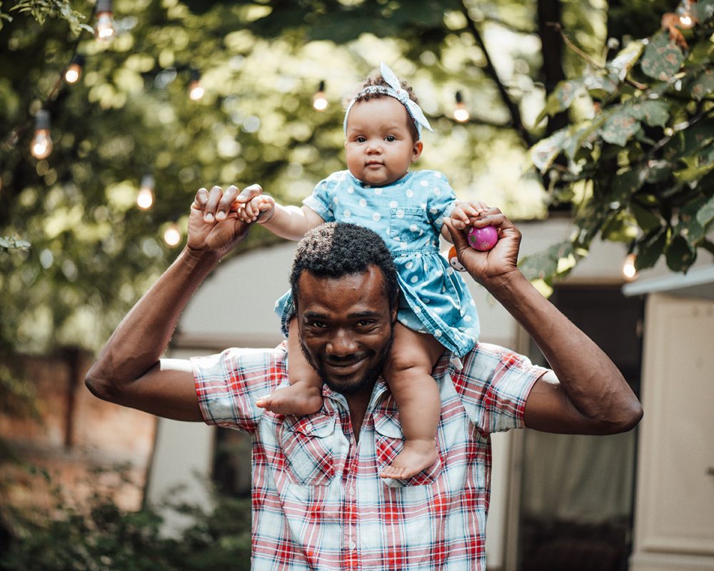 happy-black-ethnicity-dad-carries-toddler-baby-gir-2024-11-03-04-31-19-utc