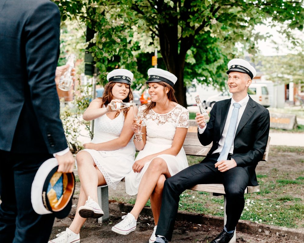 Happy university students having champagne at graduation party
